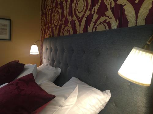 Cama o camas de una habitación en Hotel Wictoria