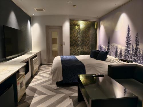 Et tv og/eller underholdning på Hotel The Moon -Adult Only-