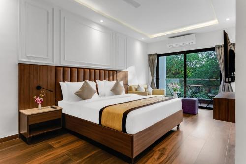 Postel nebo postele na pokoji v ubytování SinQ Symbol