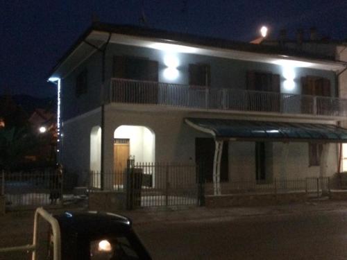 a house with lights on top of it at night at Be and Be in Montesano sulla Marcellana
