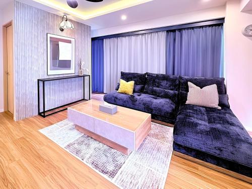a living room with a couch and a coffee table at Spacious Family Stay Shinagawa-Kokoro House in Tokyo