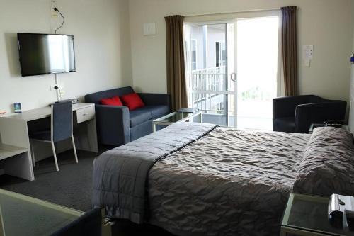 Postel nebo postele na pokoji v ubytování Hawera Central Motor Lodge