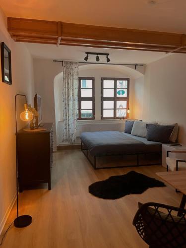 a large bedroom with a bed and a window at Ferienwohnung Querfurt in Querfurt