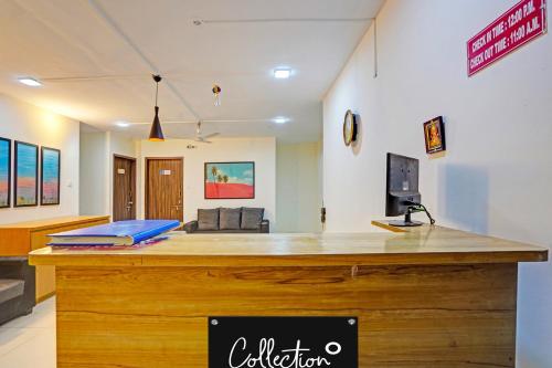 a large counter in a room with at Collection O Baner Hillview Pune Formerly Siri Lodge in Méribel Village