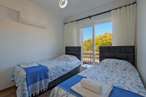 Ένα ή περισσότερα κρεβάτια σε δωμάτιο στο SUNSET BEACH CLUb