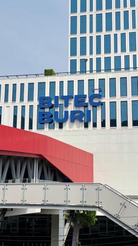 a building with a sign on the side of it at Marigold Sukhumvit - Free Shuttle to BTS Bearing Station in Bangkok