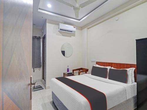 a bedroom with a large bed in a room at HOTEL PNR SUITES KUKATPALLY in Hyderabad