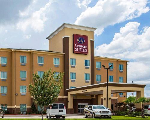 a hotel with cars parked in front of it at Comfort Suites Northwest - Cy - Fair in Houston