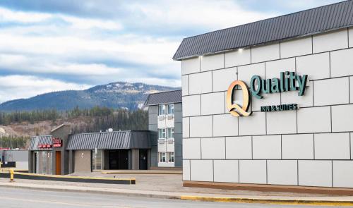 a building with a sign on the side of it at Quality Inn & Suites in Whitehorse