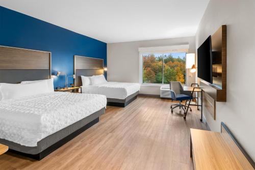 Ένα ή περισσότερα κρεβάτια σε δωμάτιο στο Tru By Hilton Brockton