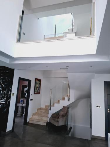 a living room with a staircase with a window at Villa Corni in Granada