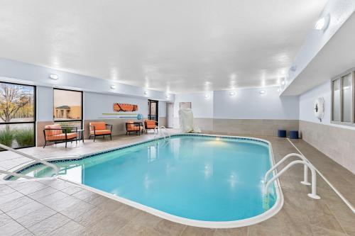 a pool in a hotel room with a living room at Hampton Inn Akron-Fairlawn in Montrose