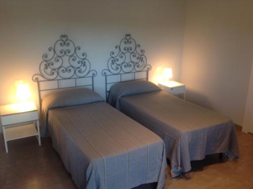 Un pat sau paturi într-o cameră la Residence Campagnole