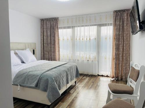 Cama o camas de una habitación en Pensiunea La Vio