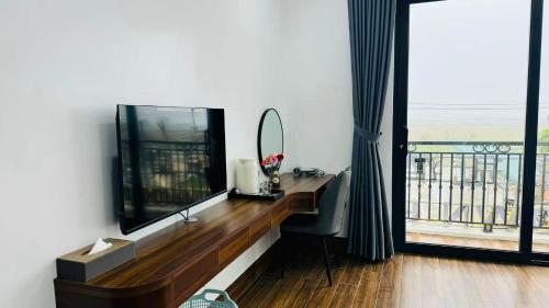 Μια τηλεόραση ή/και κέντρο ψυχαγωγίας στο Khách sạn Crown Hotel 皇冠酒店