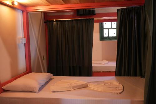 Giường trong phòng chung tại Nirvana Hiri