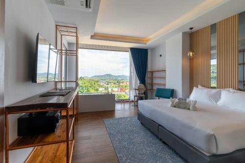 Postel nebo postele na pokoji v ubytování The Blue Hotel