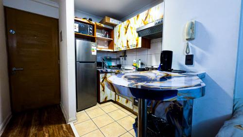 Kuchyň nebo kuchyňský kout v ubytování Santiago Centro 2 dormitorios check in tardío