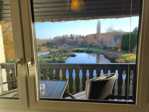 a view of a river from a window at Schwanensee App 04 in Göhren