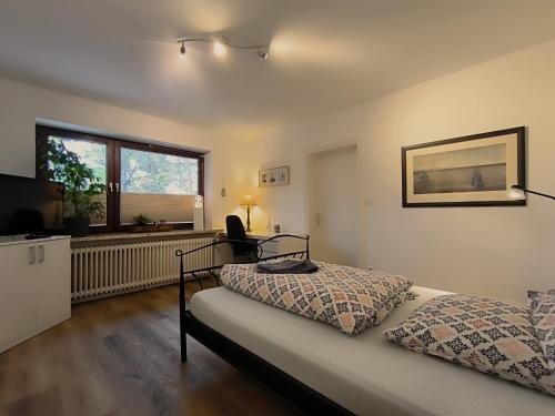 Ένα ή περισσότερα κρεβάτια σε δωμάτιο στο Ferienwohnung zwischen den Meeren - schöne und gemütliche FeWo mit Garten