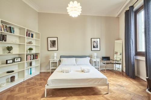 Ένα ή περισσότερα κρεβάτια σε δωμάτιο στο Easylife - Milano - Battisti 13 - Duomo