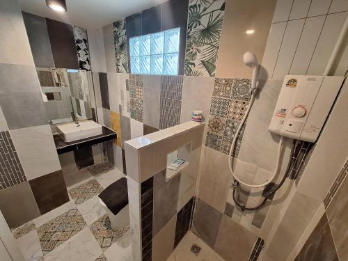 a bathroom with a sink and a shower in it at So Good in Pai