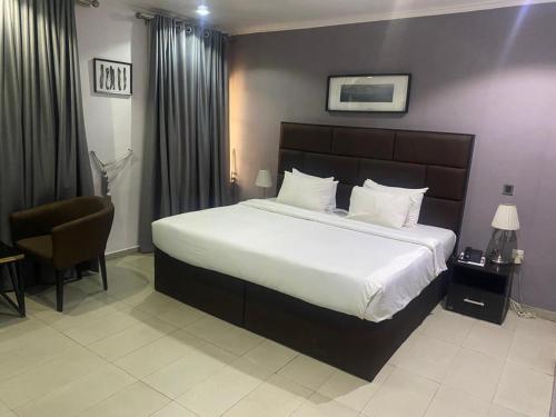 Ένα ή περισσότερα κρεβάτια σε δωμάτιο στο Modex Hotel