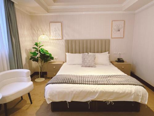 Postel nebo postele na pokoji v ubytování 米窩飯店-三重館Meworld Hotel-Sanchong