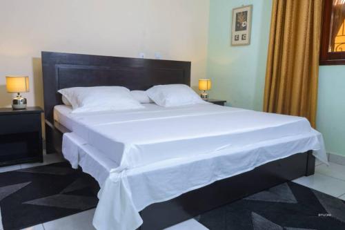 Giường trong phòng chung tại Marina hsl