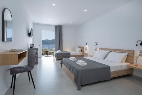 Postel nebo postele na pokoji v ubytování Hotel Filoxenia Paleros