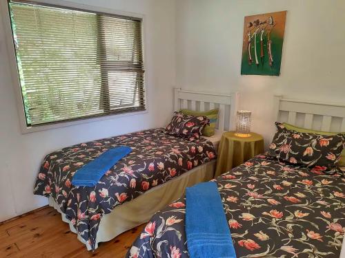 Ένα ή περισσότερα κρεβάτια σε δωμάτιο στο 180 Degrees Ocean View Dune House