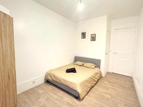 En eller flere senge i et værelse på Aux portes de Paris