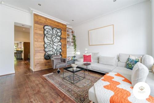a living room with a couch and a table at Elegant 5-Bed House Free Parking Edgbaston, Birmingham in Birmingham