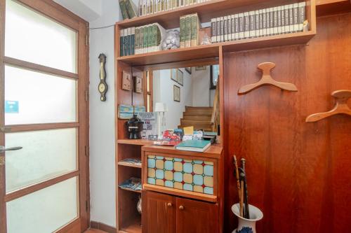 a room with wooden shelves and a window at Chicca Di Francesca- Santa Teresa in Santa Teresa Gallura