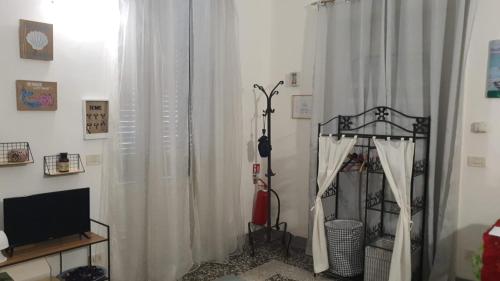 TV a/nebo společenská místnost v ubytování Appartamento Patty