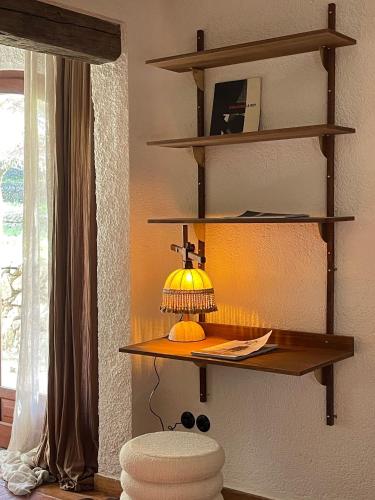 a shelf with a lamp on a wall at Casa Richello in Parcent