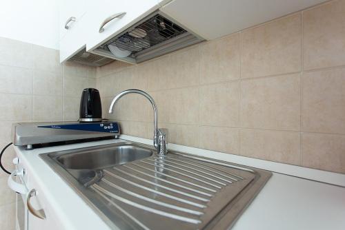 Η κουζίνα ή μικρή κουζίνα στο Le Quartier