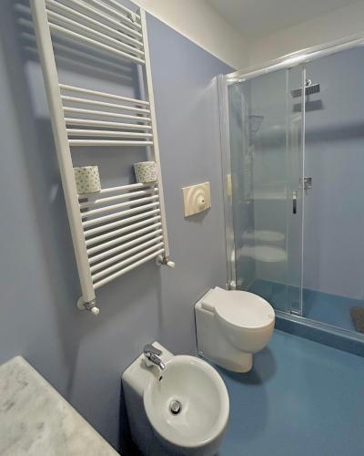 a bathroom with a toilet and a shower and a sink at Carafa di Maddaloni Residenza di Charme in Naples