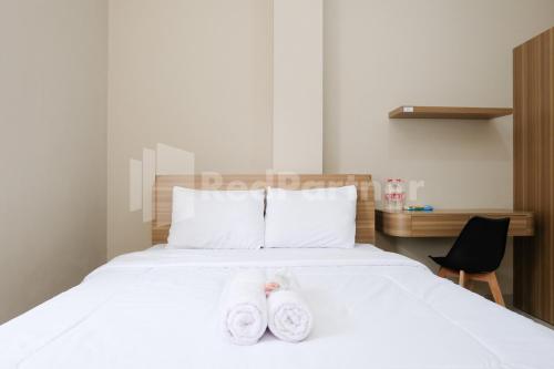 Ένα ή περισσότερα κρεβάτια σε δωμάτιο στο Pesona Merapi Syariah Guesthouse Kaliurang RedPartner