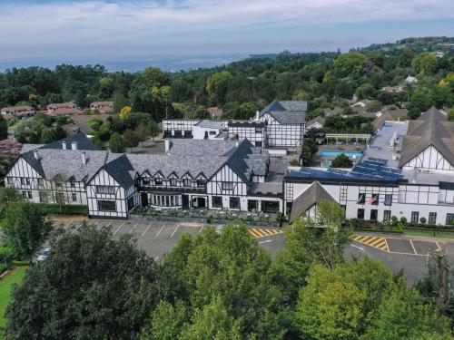 an aerial view of a town with white buildings at ANEW Hotel Hilton Pietermaritzburg in Hilton