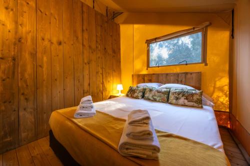 Ένα ή περισσότερα κρεβάτια σε δωμάτιο στο Fattoria delle Ripalte