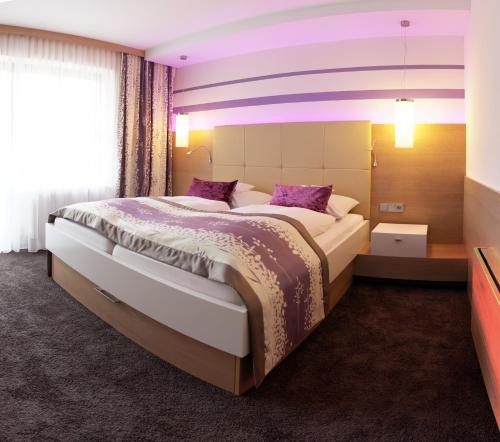Ένα ή περισσότερα κρεβάτια σε δωμάτιο στο Hotel Lenauhof