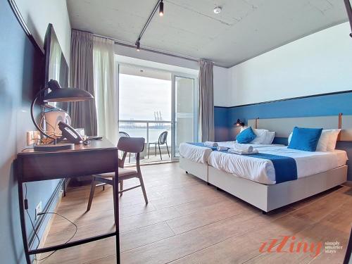 Postel nebo postele na pokoji v ubytování South 32 Hotel by Zzzing