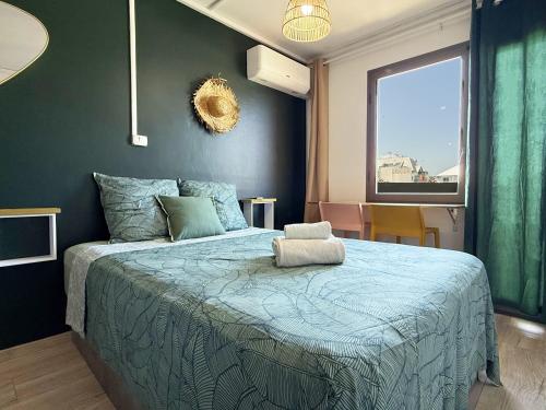 Una cama o camas en una habitación de Le Vert Sauvage - Plage et Ville - Clim