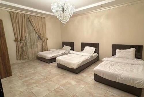 Ένα ή περισσότερα κρεβάτια σε δωμάτιο στο مسكن الهجرة