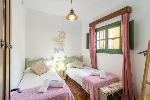 Ένα ή περισσότερα κρεβάτια σε δωμάτιο στο Cubo's Casa Rural San Cristobal Cortijo el Puntal