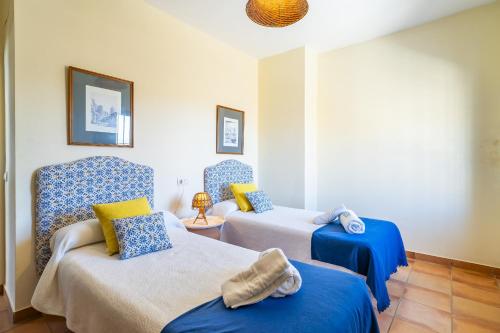 Ένα ή περισσότερα κρεβάτια σε δωμάτιο στο Cubo's Casa Rural La Camorra Cortijo el Puntal