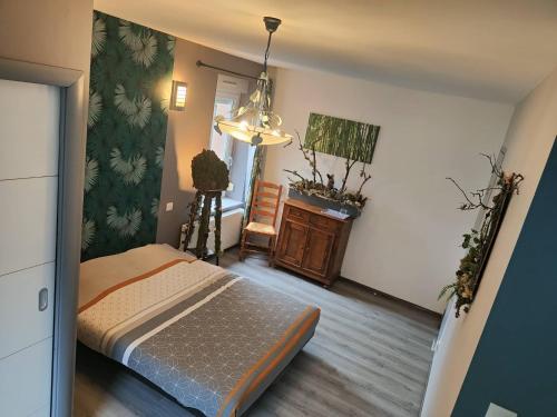 Ένα ή περισσότερα κρεβάτια σε δωμάτιο στο l'Adapté