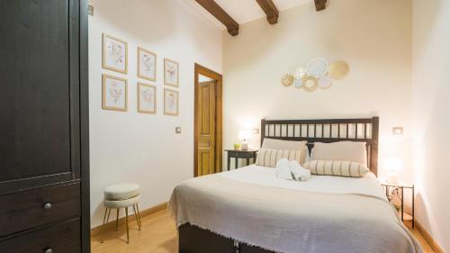 Ένα ή περισσότερα κρεβάτια σε δωμάτιο στο Apartamento Pozo Amargo Junto a la Catedral by Toledo AP