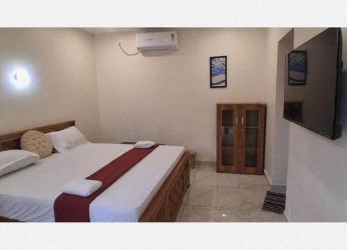 Ένα ή περισσότερα κρεβάτια σε δωμάτιο στο RB Tourist Home